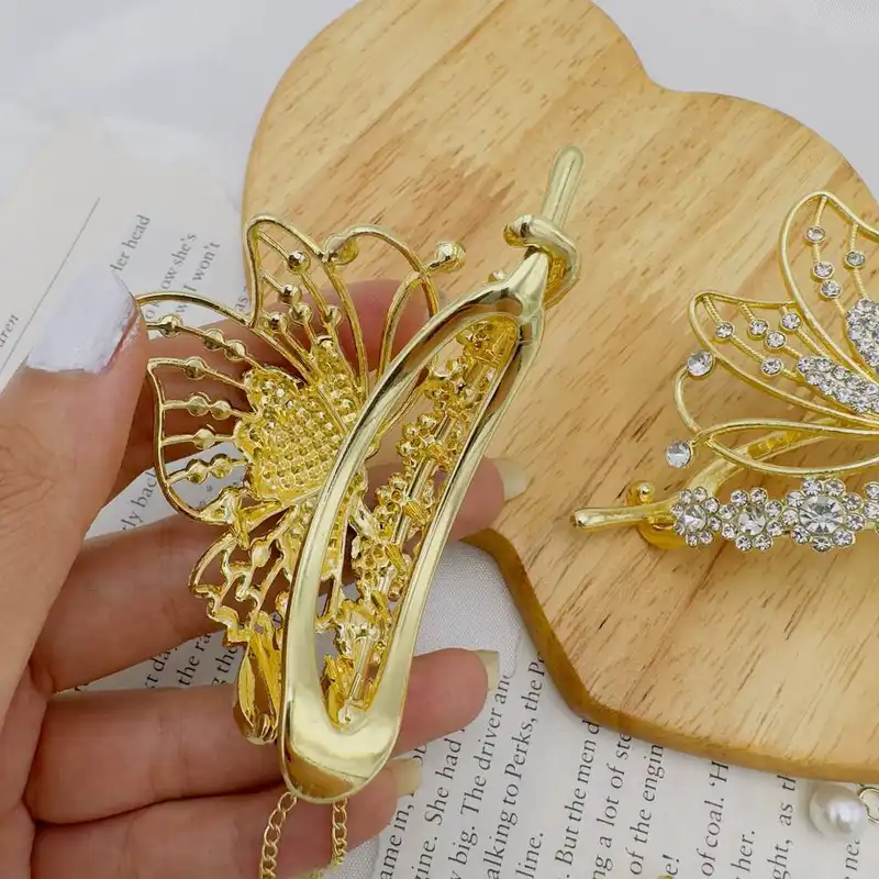 گیره مو زنانه مدل آبشاری چفتی طرح پروانه نگینی