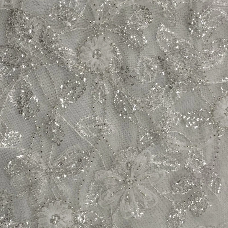 پارچه لباس عرض ۱.۵ متر مدل توری کار شده مجلسی رنگ سفید