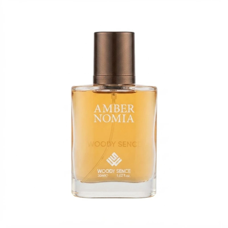 عطر جیبی وودی سنس مدل Amber Nomia با رایحه تلخ و چوبی حجم 30 میلی‌لیتر