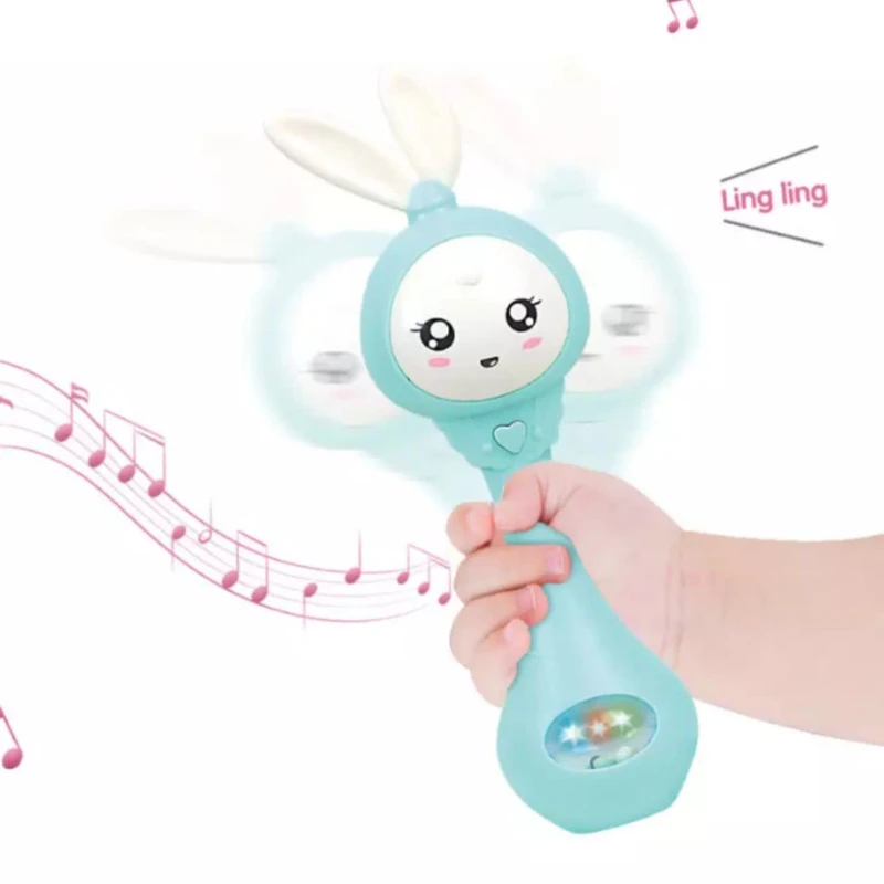 عکس شماره 5 : جغجغه ناب سل مدل دستی دندان گیر چراغدار موزیکال خرگوش بامزه کد funny rabbit teething hand rattle