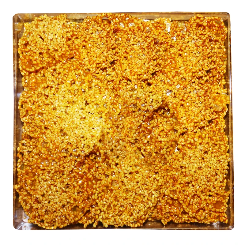 شیرینی سوهان توری تساج کنجدی - 270 گرم