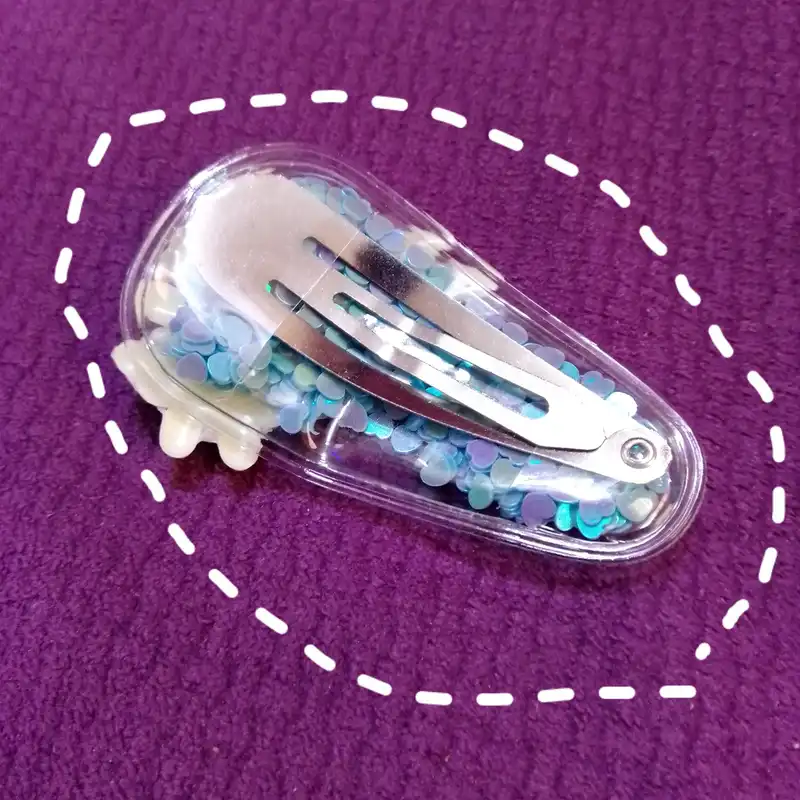 گیره مو زنانه مدل تق تقی آکواریومی طرح فرشته بالدار