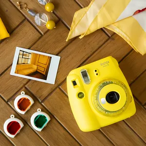دوربین عکاسی چاپ سریع فوجی فیلم مدل Instax Mini 9 Clear به همراه یک بسته فیلم مدل Despicable Me بسته ۱۰ عددی 
