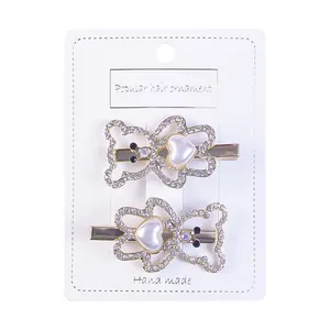 گیره مو زنانه مدل خرس و قلب نگین دار کد 4063 بسته 2 عددی