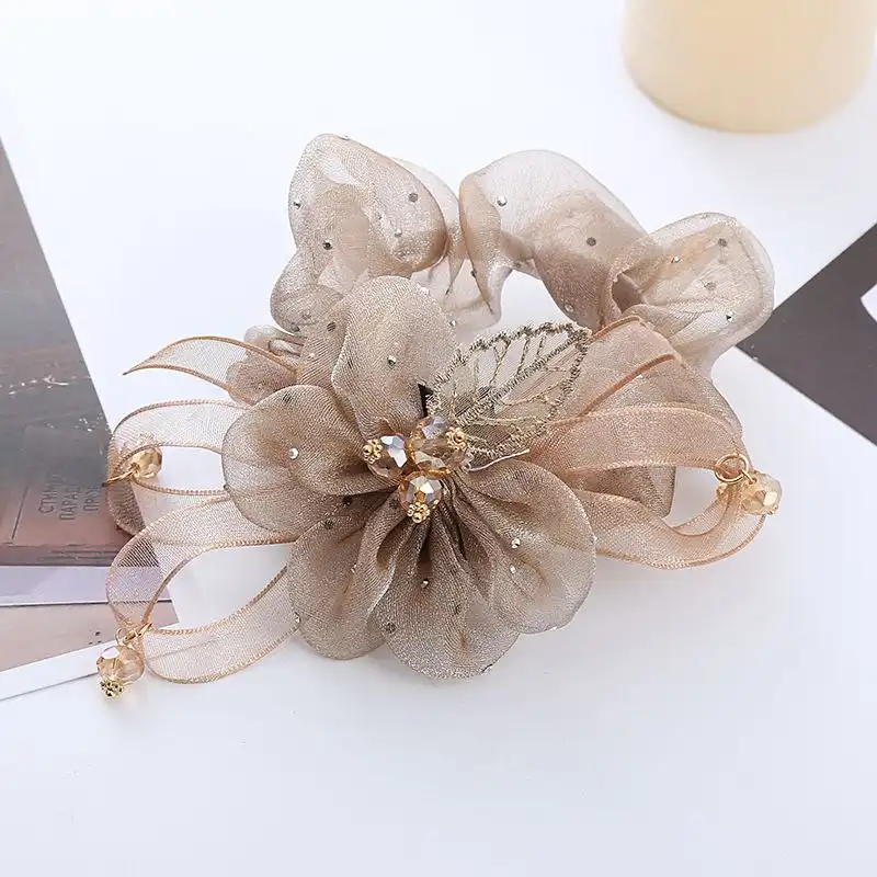 کش مو زنانه مدل گل و برگ کریستالی