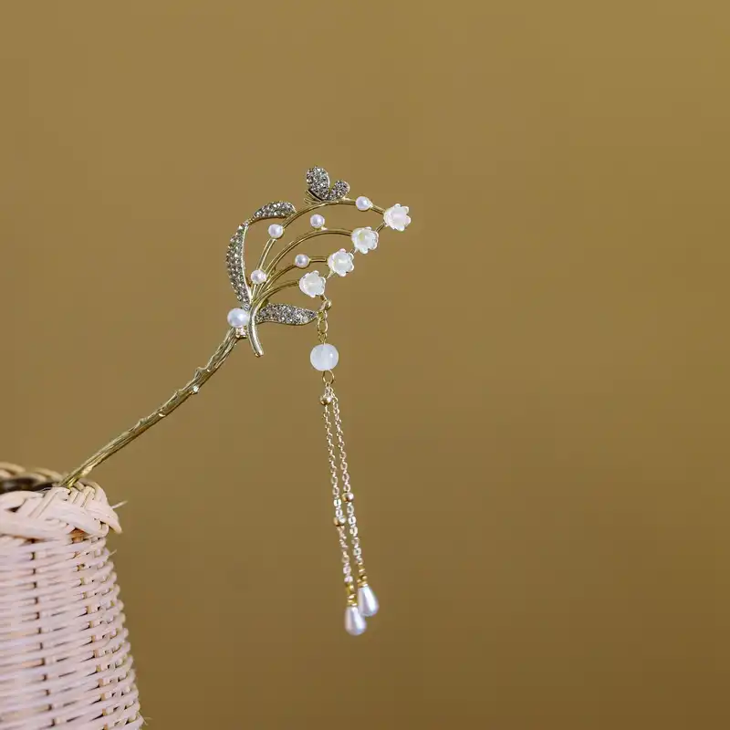 گیره مو زنانه مدل کانزاشی طرح سبد گل های شیپوری آویزدار