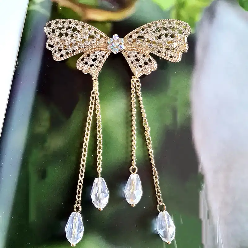 گیره مو زنانه مدل پاپیون آویزدار کد brg 4040