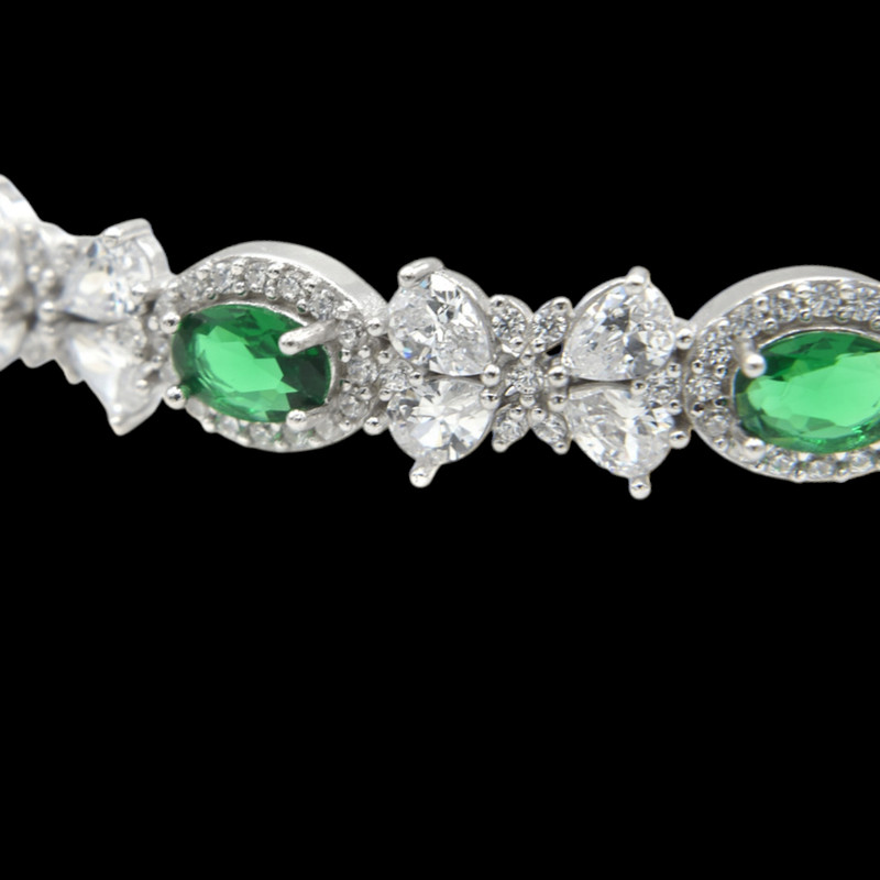 دستبند نقره زنانه گالری رضازاده مدل پاپیون فلاور زمرد 0268