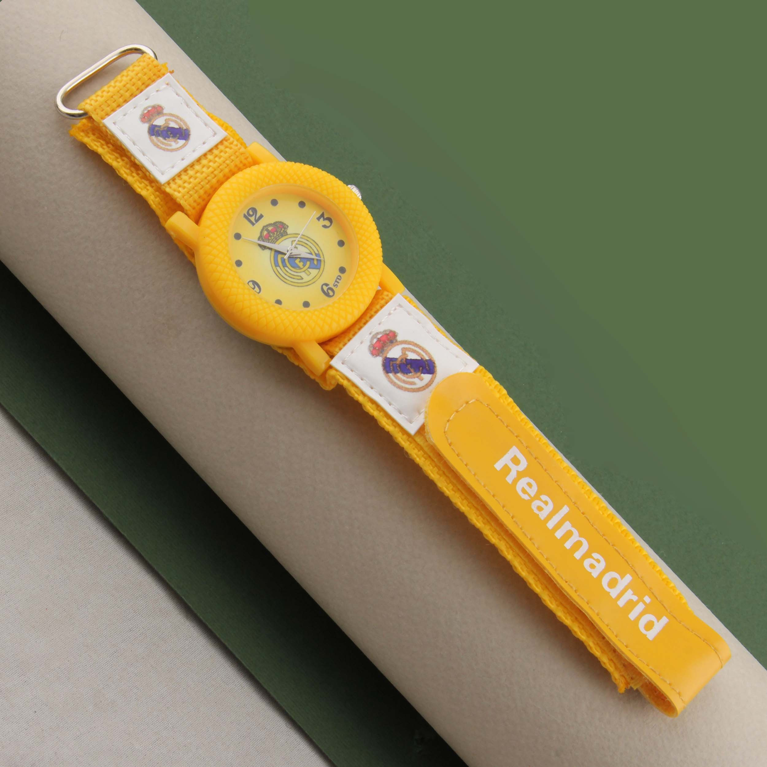 ساعت مچی عقربه ای پسرانه مدل ورزشی بند کتان چسبی طرح رئال مادرید کد WHK_091 ساعت مچی عقربه ای پسرانه مدل ورزشی بند کتان چسبی طرح رئال مادرید کد WHK_091