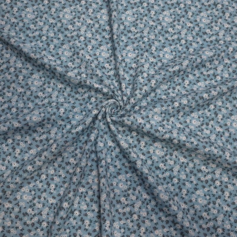 پارچه لباس عرض 1.45 متر مدل مخمل کبریتی گلریز رنگ فیروزه‌ای