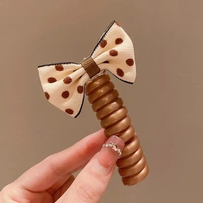 کش مو زنانه مدل فنری طرح پاپیون خال دار