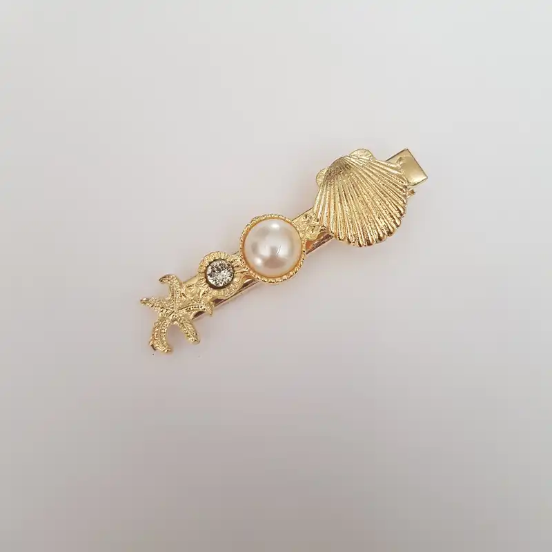 گیره مو زنانه مدل صدف مرواریدی