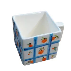 فنجان سرامیکی مدل مکعبی طرح پرتقال کد ZP140