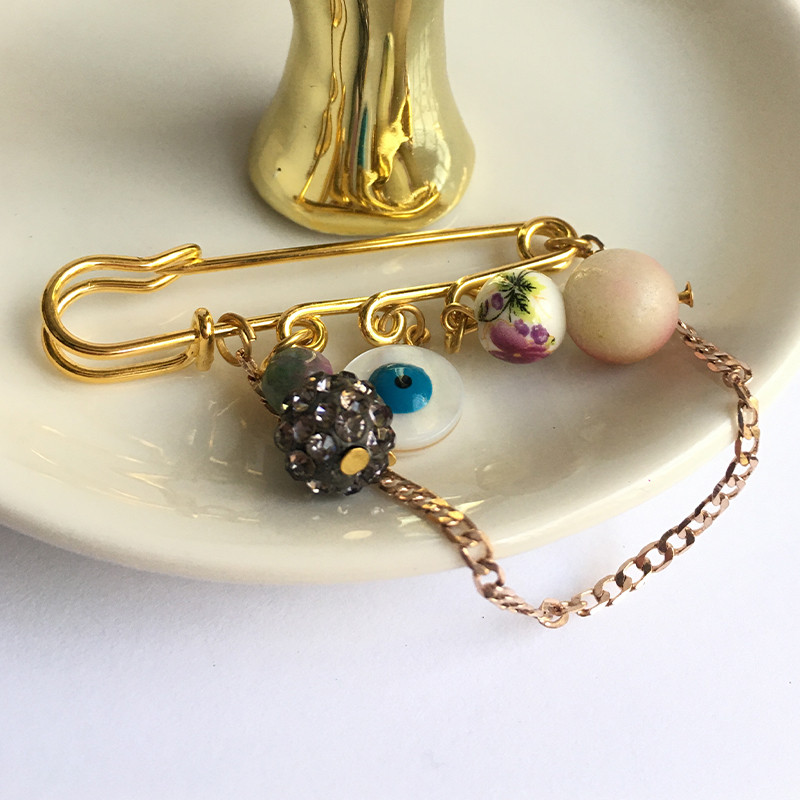 گل سینه زنانه مدل چشم نظر