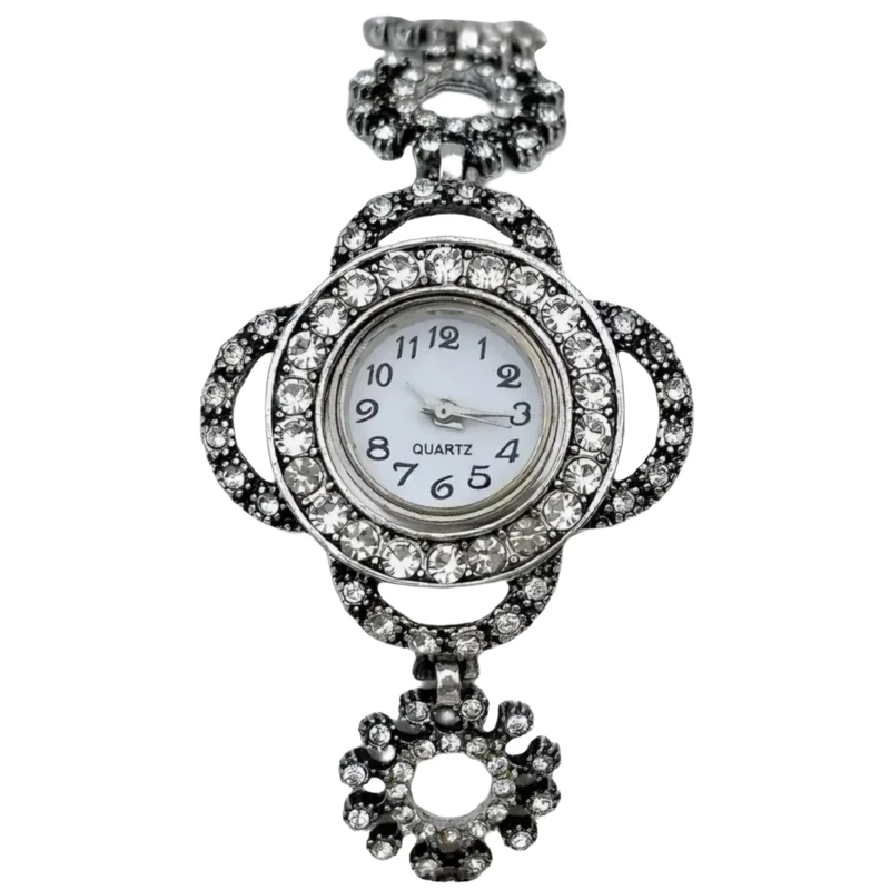 ساعت مچی عقربه‌ای کوارتز زنانه مدل دور نگین طرح نقره سیاه قلم کد 1
