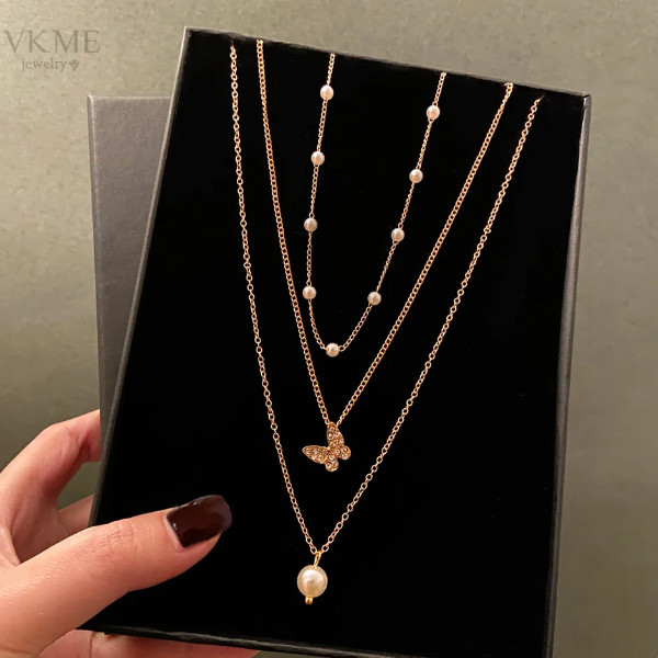 گردنبند دخترانه مدل مروارید و پروانه مجموعه سه عددی گردنبند دخترانه مدل مروارید و پروانه مجموعه سه عددی