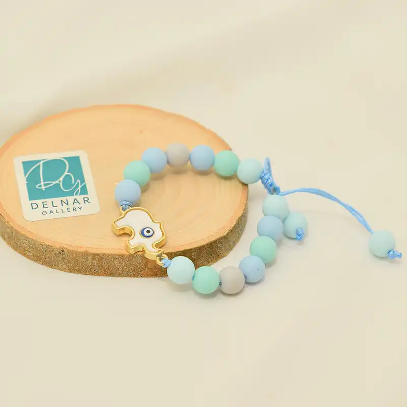 دستبند دخترانه دلنار گالری مدل فیل و چشم نظر صدفی