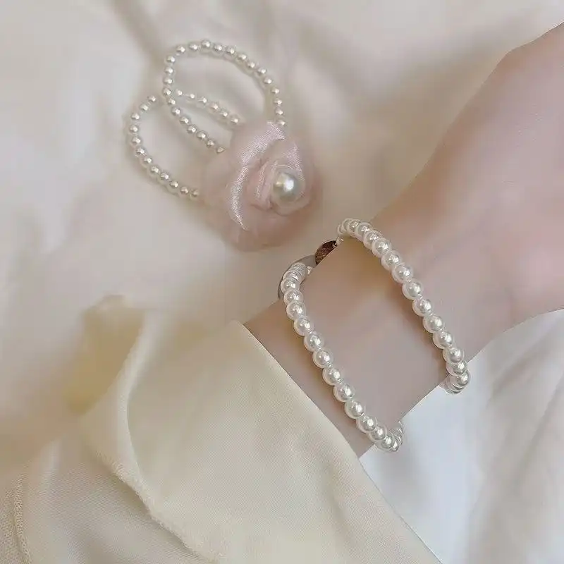 کش مو زنانه مدل گل بابونه و مروارید