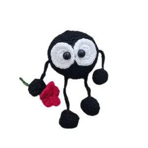 عروسک بافتنی طرح دوده با شاخه گل