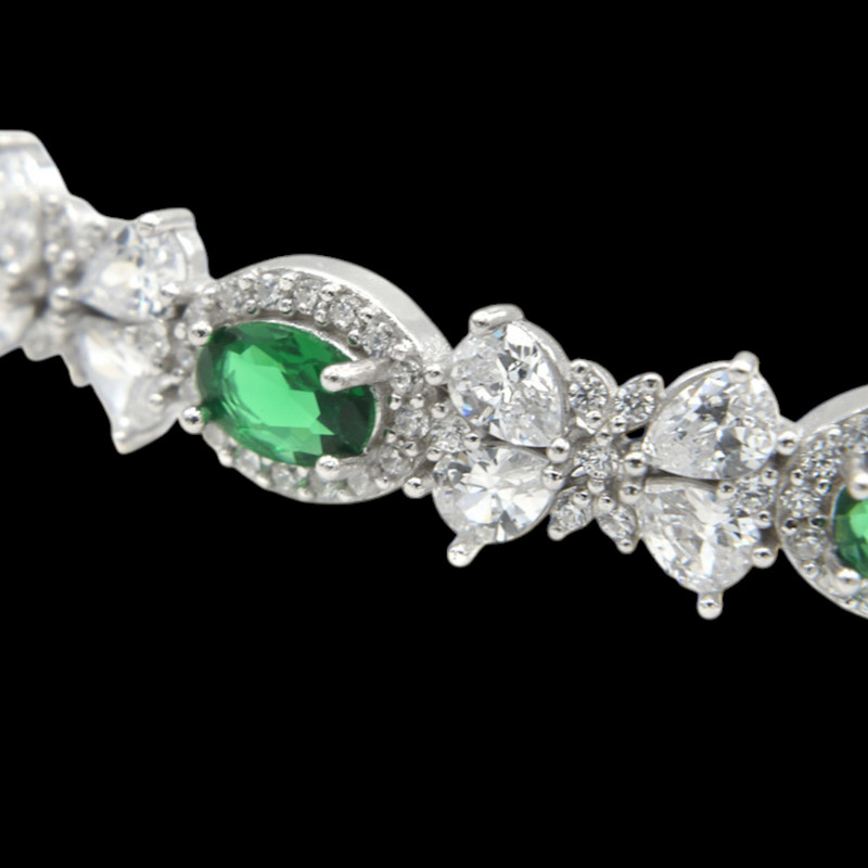 دستبند نقره زنانه گالری رضازاده مدل پاپیون فلاور زمرد 0268